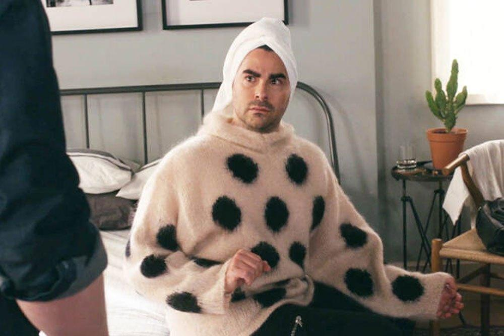 Dan Levy as David Rose wearing a beige mohair polka-dotted sweater in Schitt’s Creek